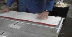 Breather Fabric is positioned over Bleed Film Breather Fabric is positioned over Bleed Film