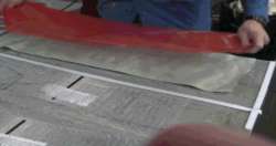 Perforated Bleed Film is positioned over Peel Ply Perforated Bleed Film is positioned over Peel Ply