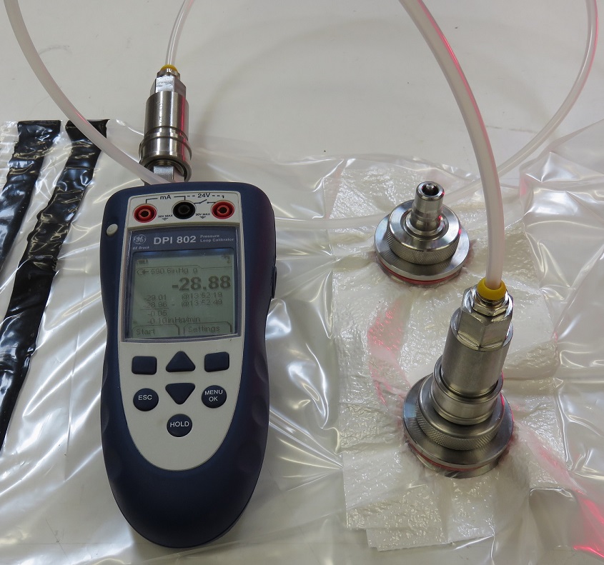 Vacuum drop test setup with internal sensor